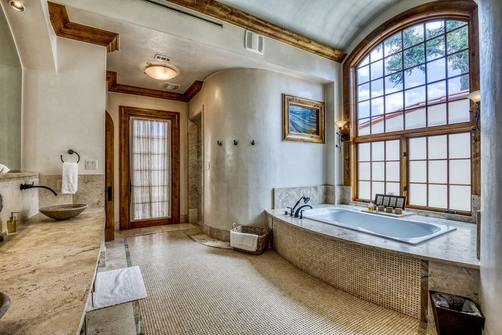 A grand bathroom with plenty of privacy.