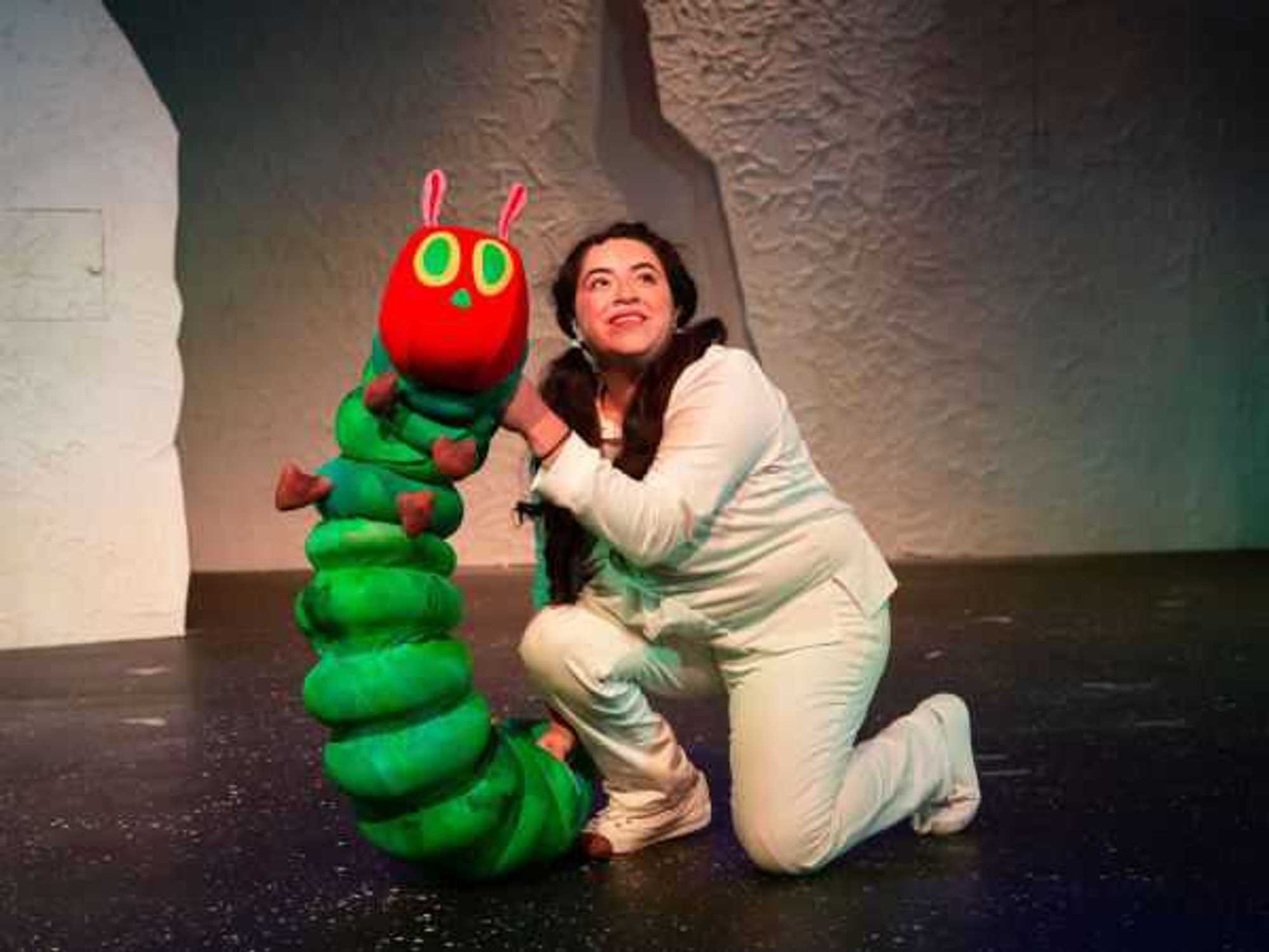 A puppeteer are the renovated Magik Theatre performs The Very Hungry Caterpillar
