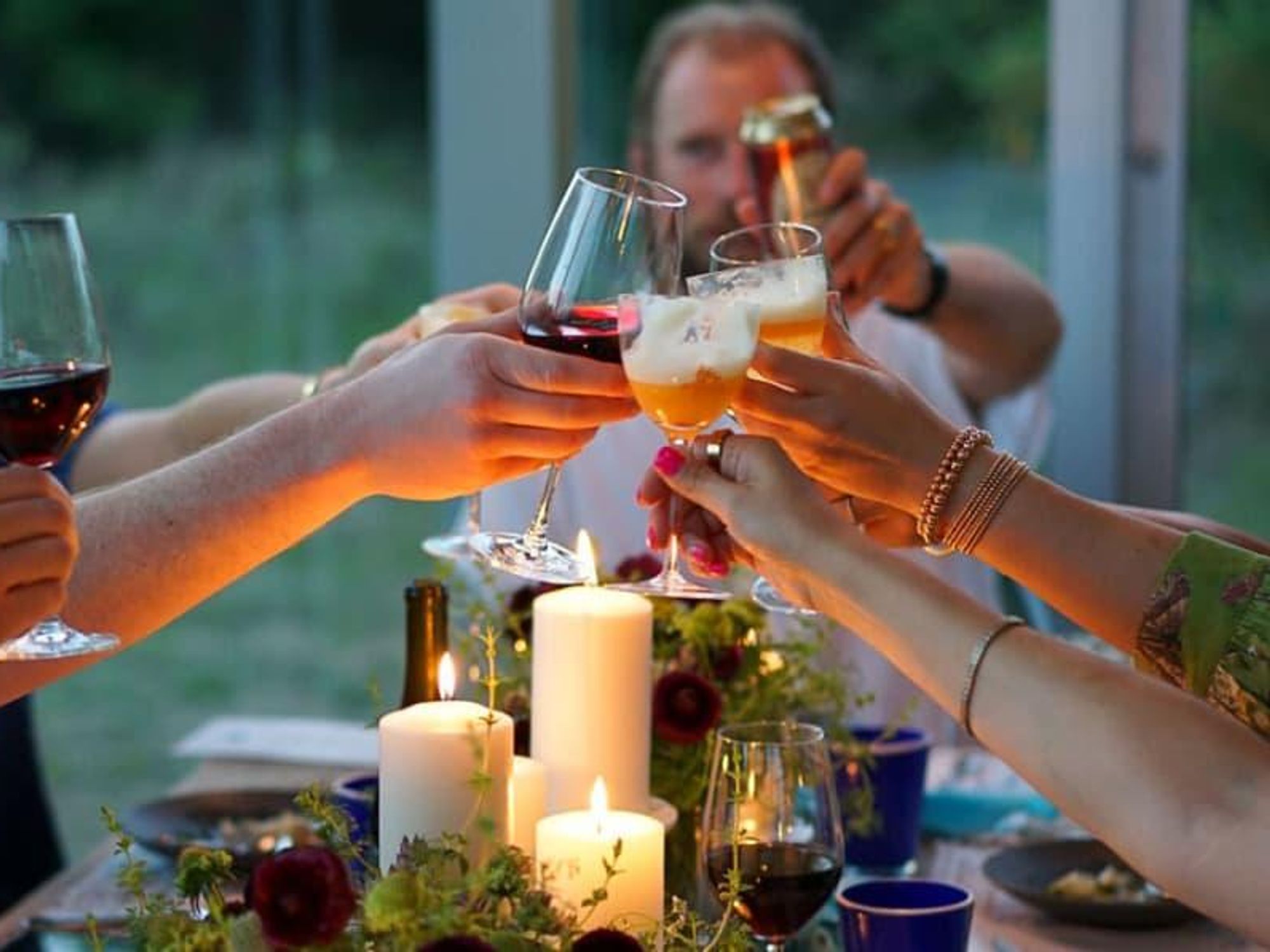A wine toast over a table set by Tivity in Austin.