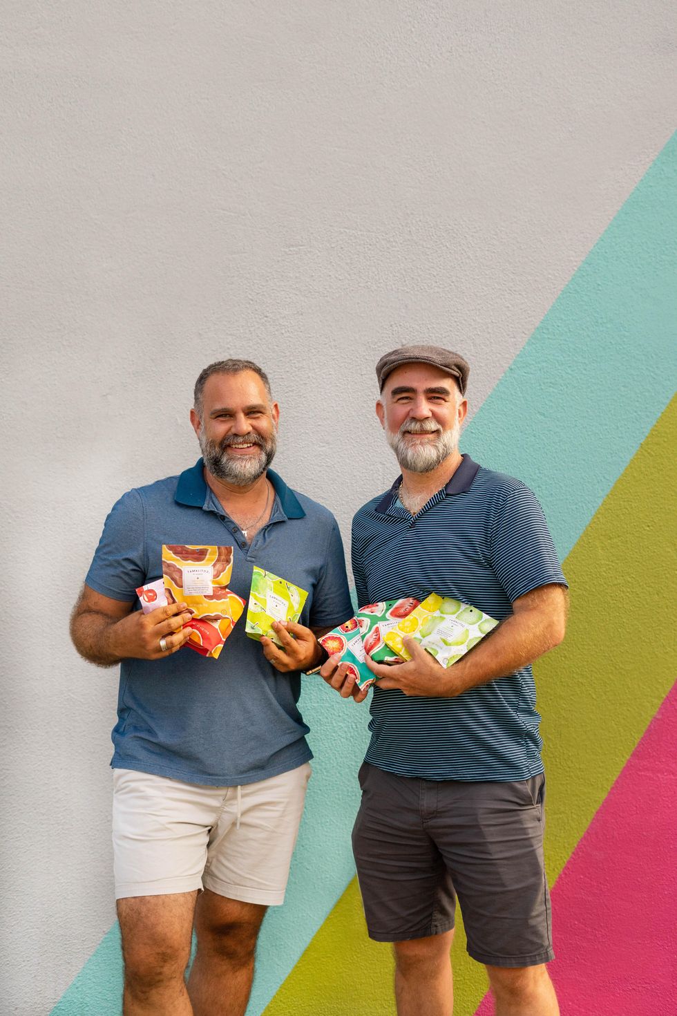 Austin-based Tamalitoz founders holding candy packages.