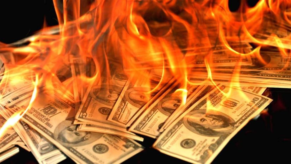 burning money 100 hundred dollar bills