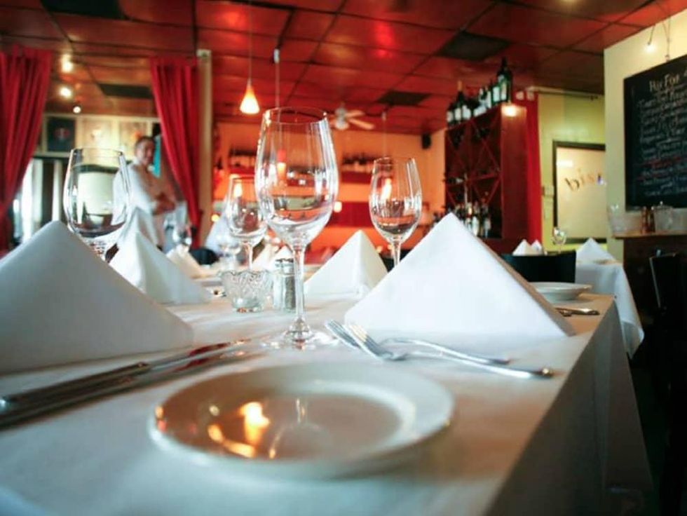 Chez Vatel Bistro table wine glass interior San Antonio restaurant