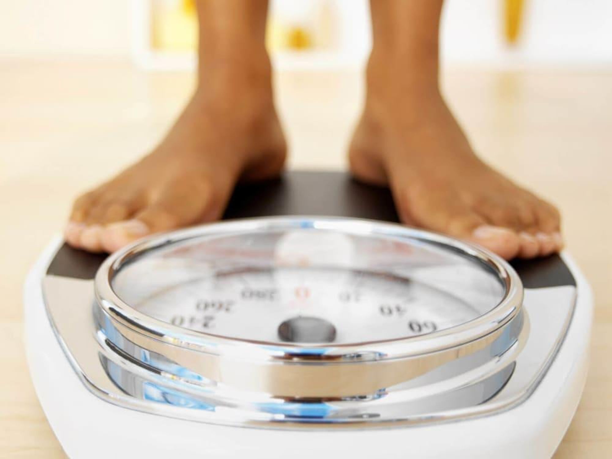 child's feet on a scale