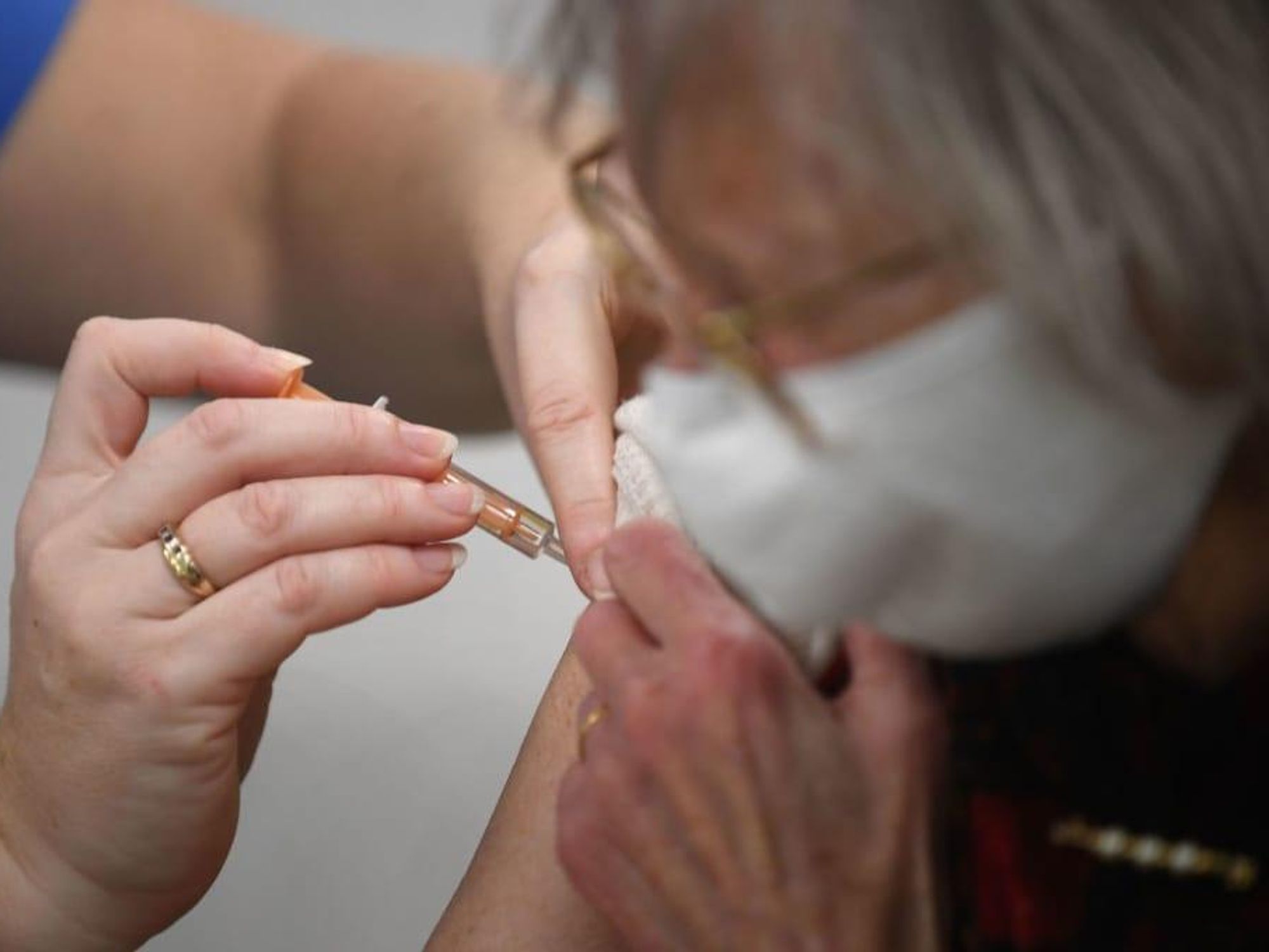 COVID-19 vaccine woman getting shot