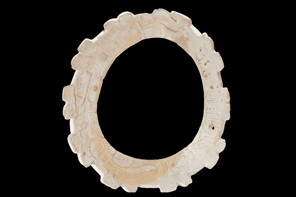 Decorated Shell Pendant with Glyphs