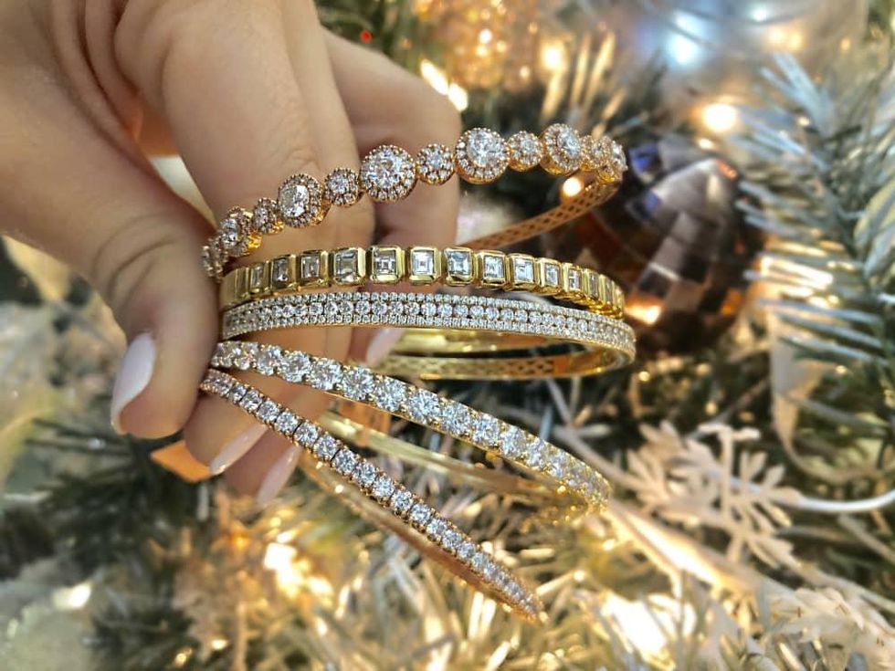 Diamond bracelets in front of Christmas tree