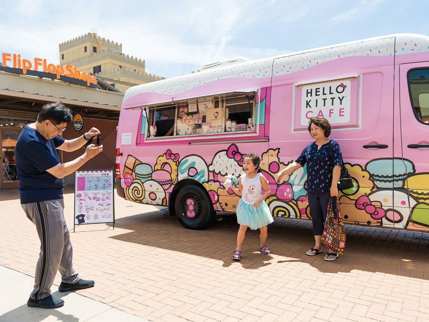 Family taking pictures at the Hello Kitty Cafe Truck