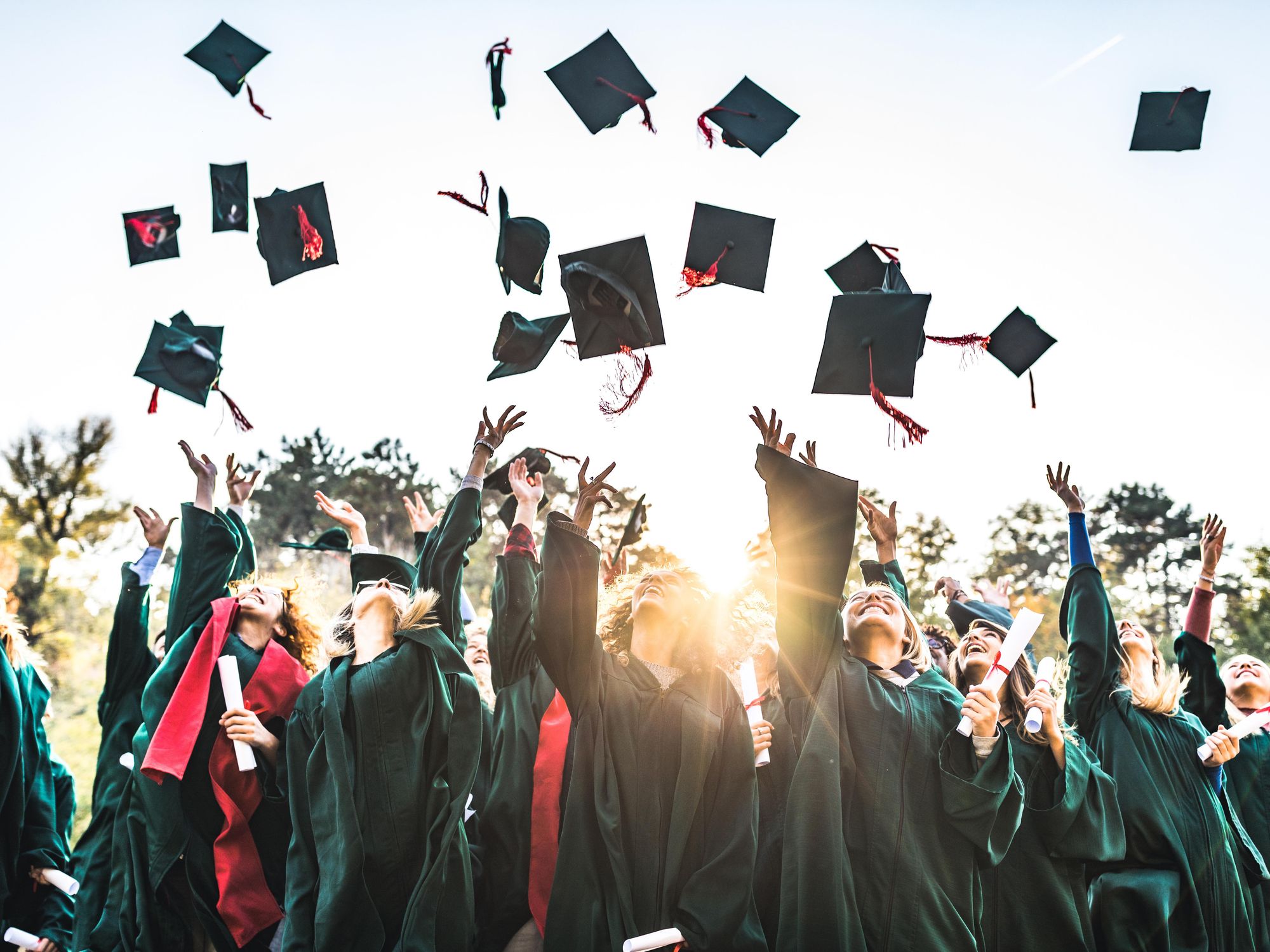 Graduates tossing their caps