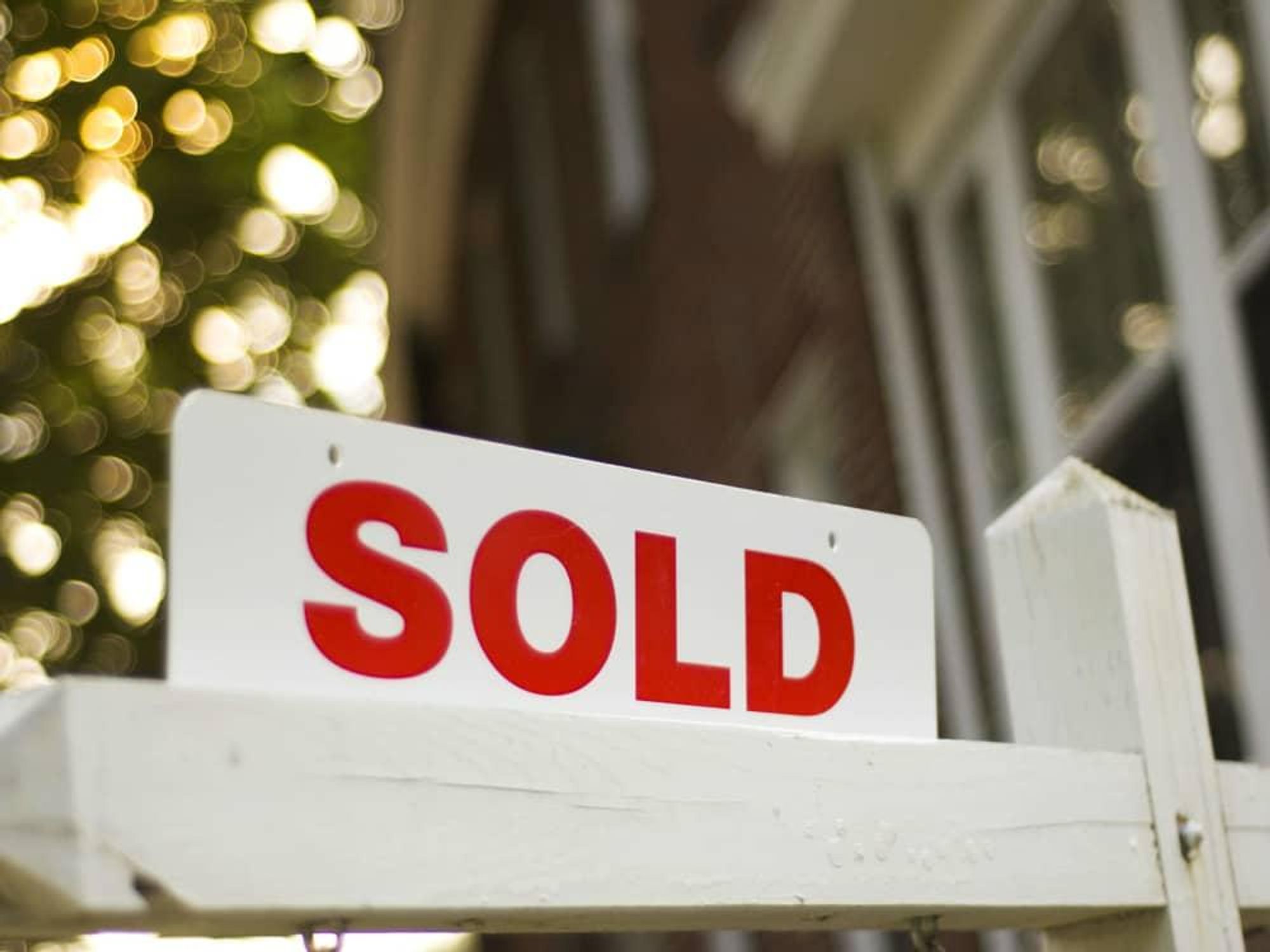 Home for sale sold sign