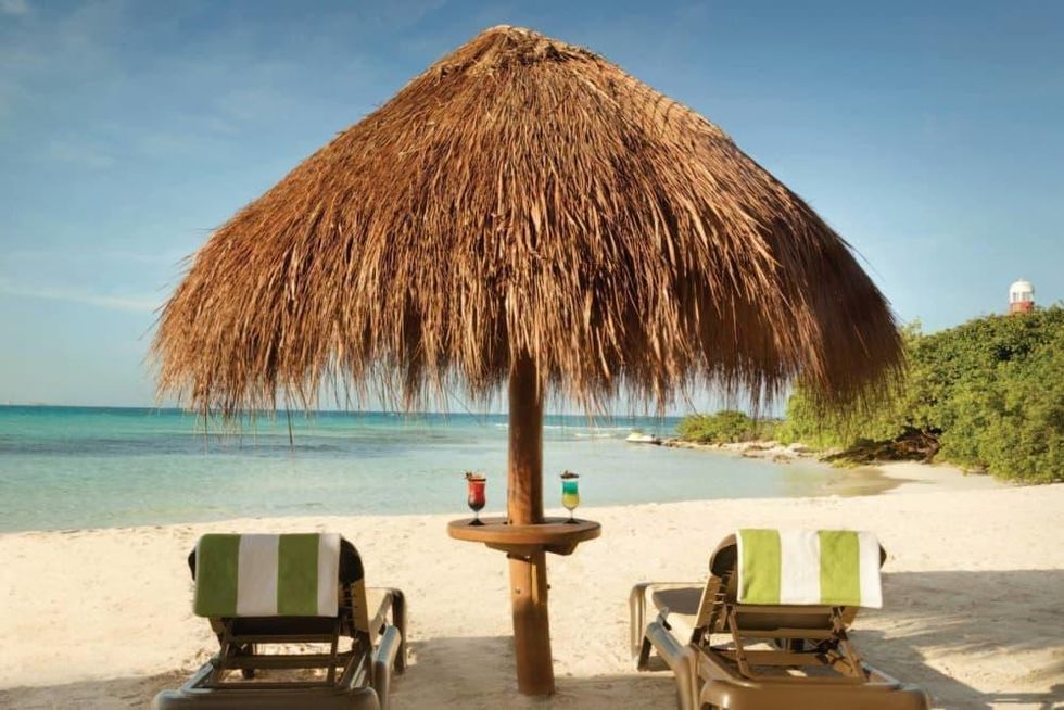 Hyatt Ziva Cancun beach chairs tropical drinks vacation
