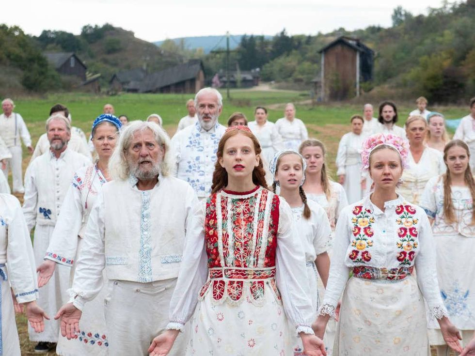 Isabelle Grill (center) and cast of Midsommar