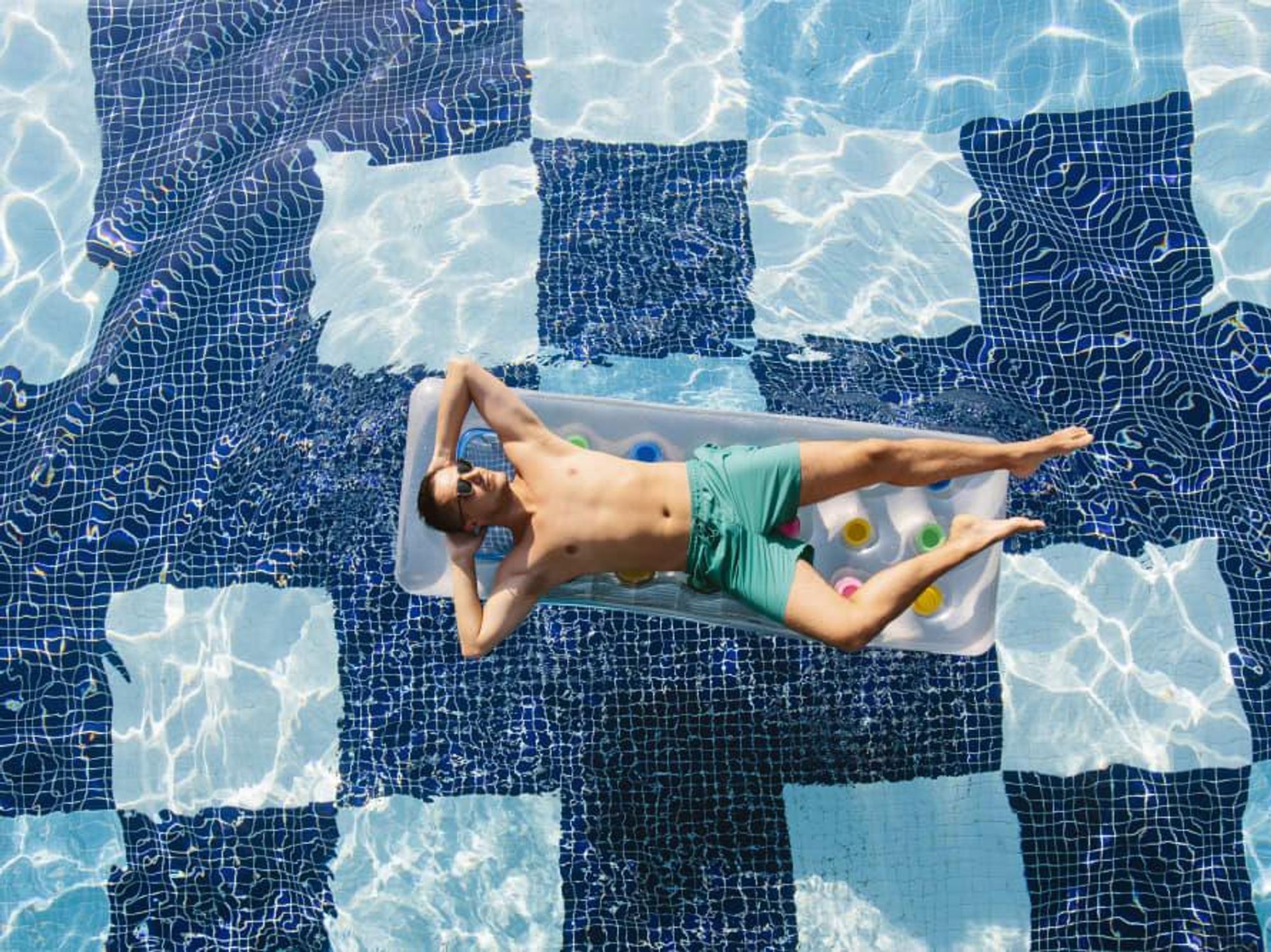 Man floating in a pool