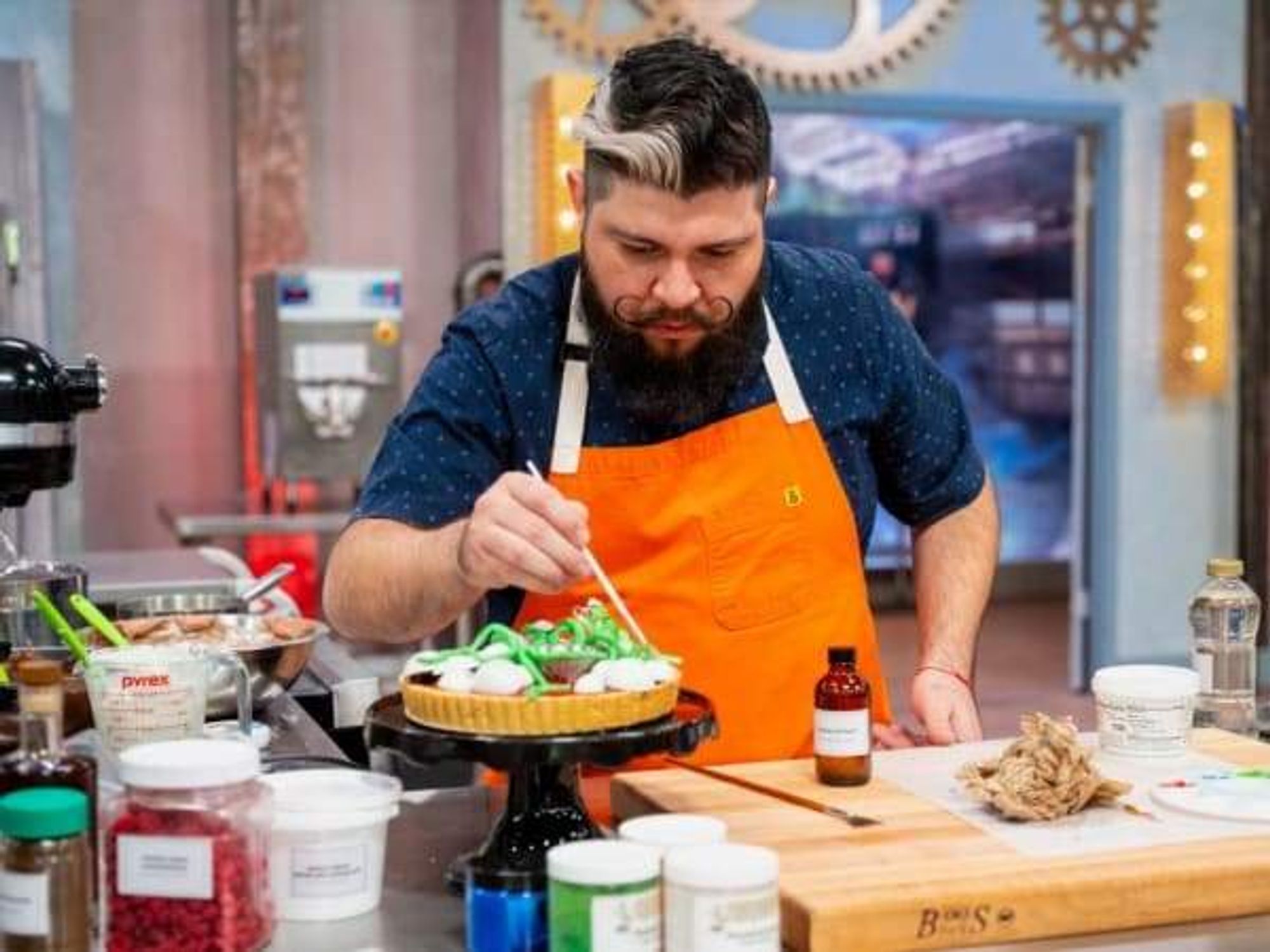 Manny Martinez, owner of Grim Bakers in San Antonio, focuses on decorations in the 10th season of Halloween Baking Championship.