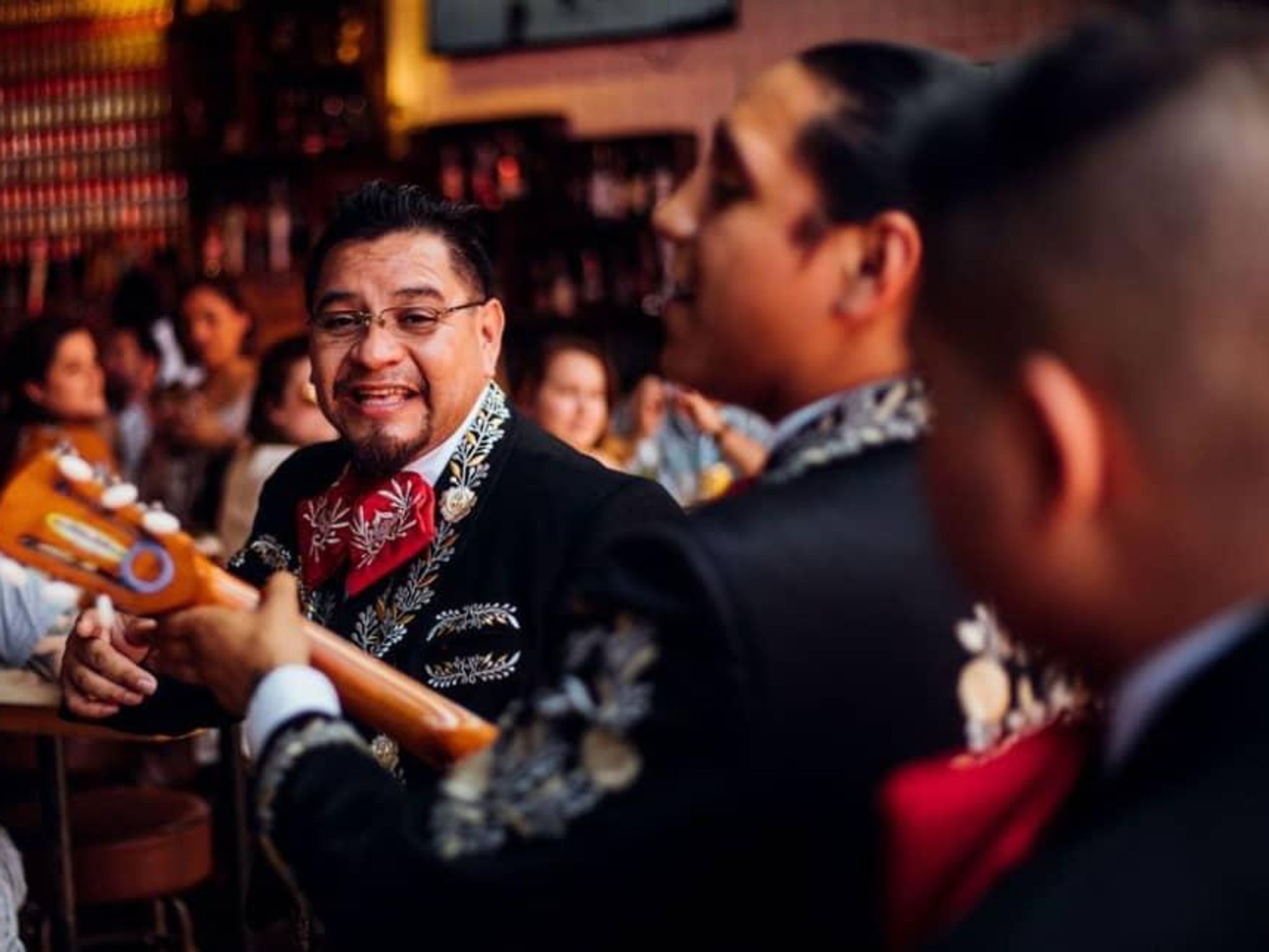 Mariachi musicians play inside a bar on Cinco de Mayo