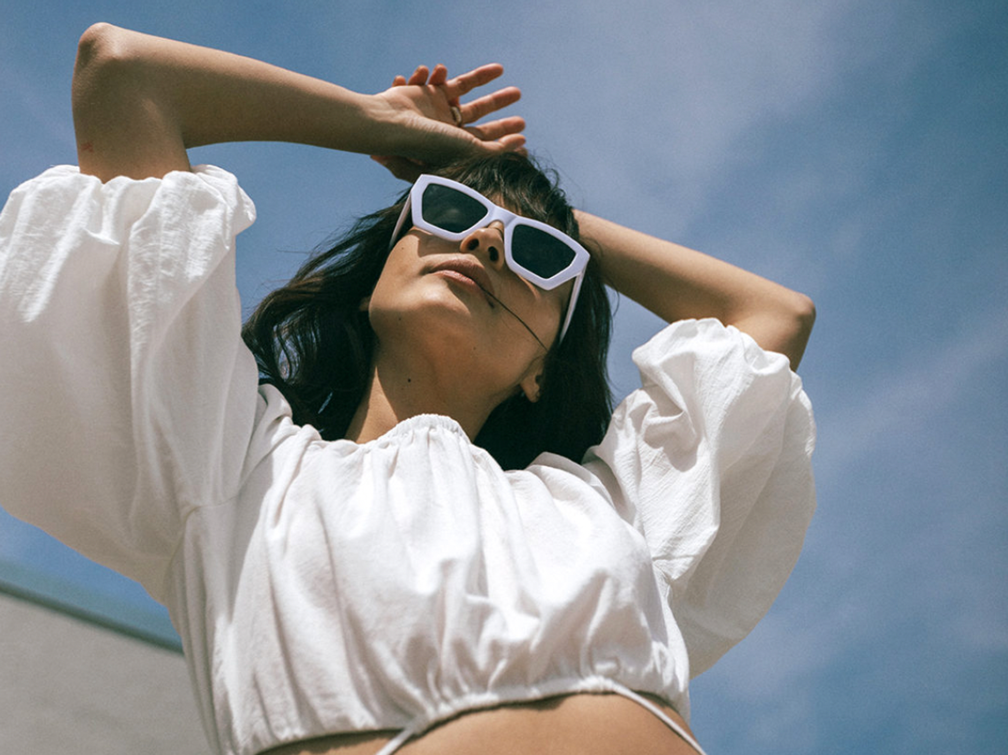 Nordstrom Rack model in shirt and sunglasses