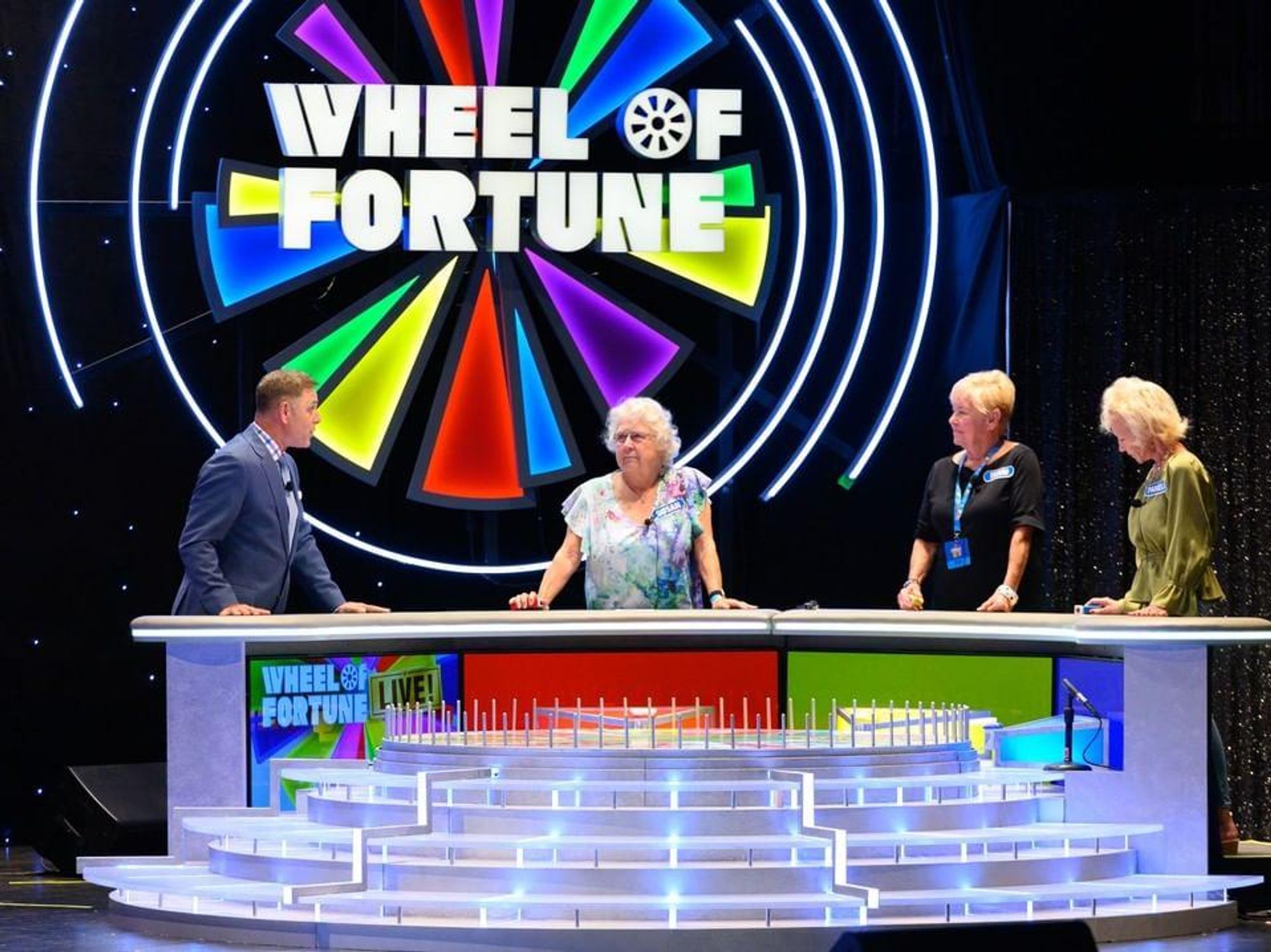 Participants on Wheel of Fortune Live.