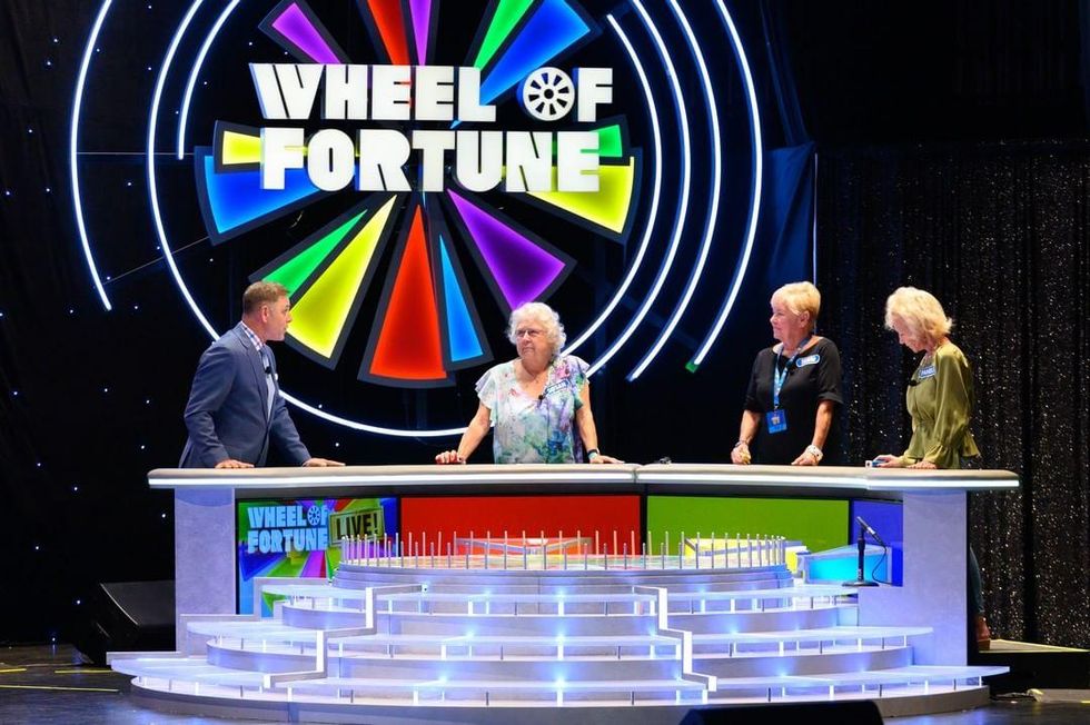 Participants on Wheel of Fortune Live.