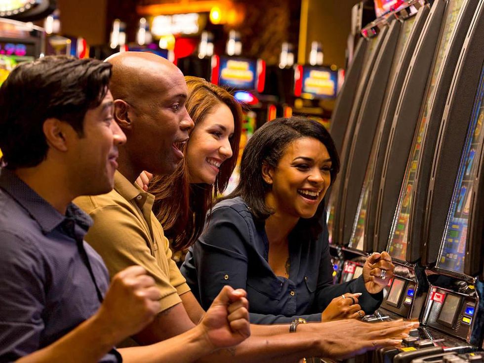 People playing slot machines