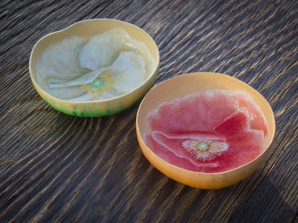 Photo of painted bowls made of gourds