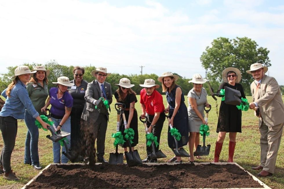 Project partners break ground on the Garcia Street Urban Farm.