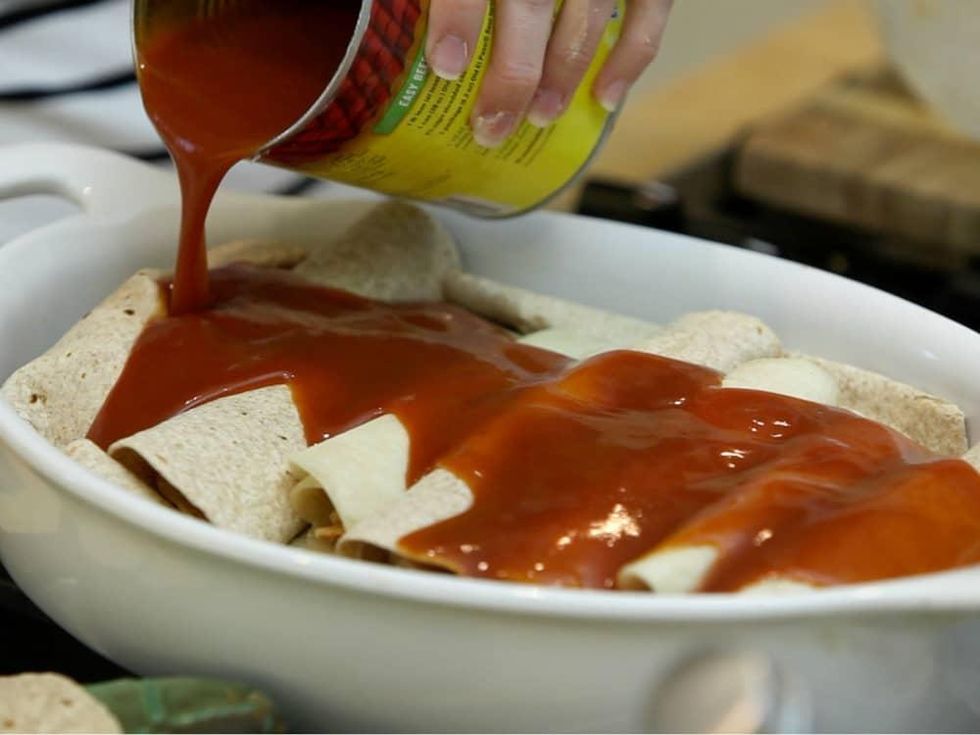 Roni Proter preparing enchiladas