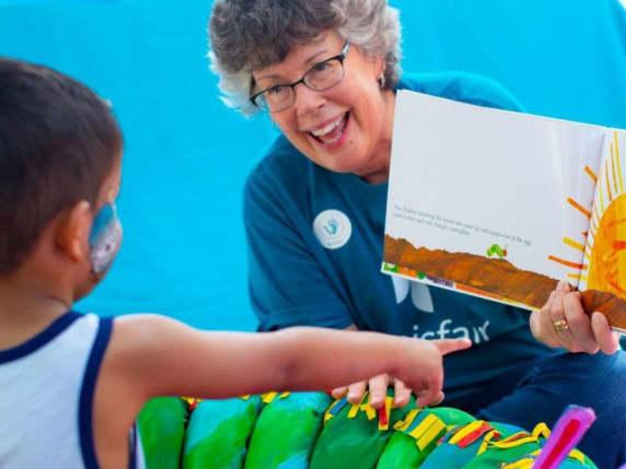 San Antonio Ms. Kim woman reading to boy San Antonio Virtual storytelling hemisfair