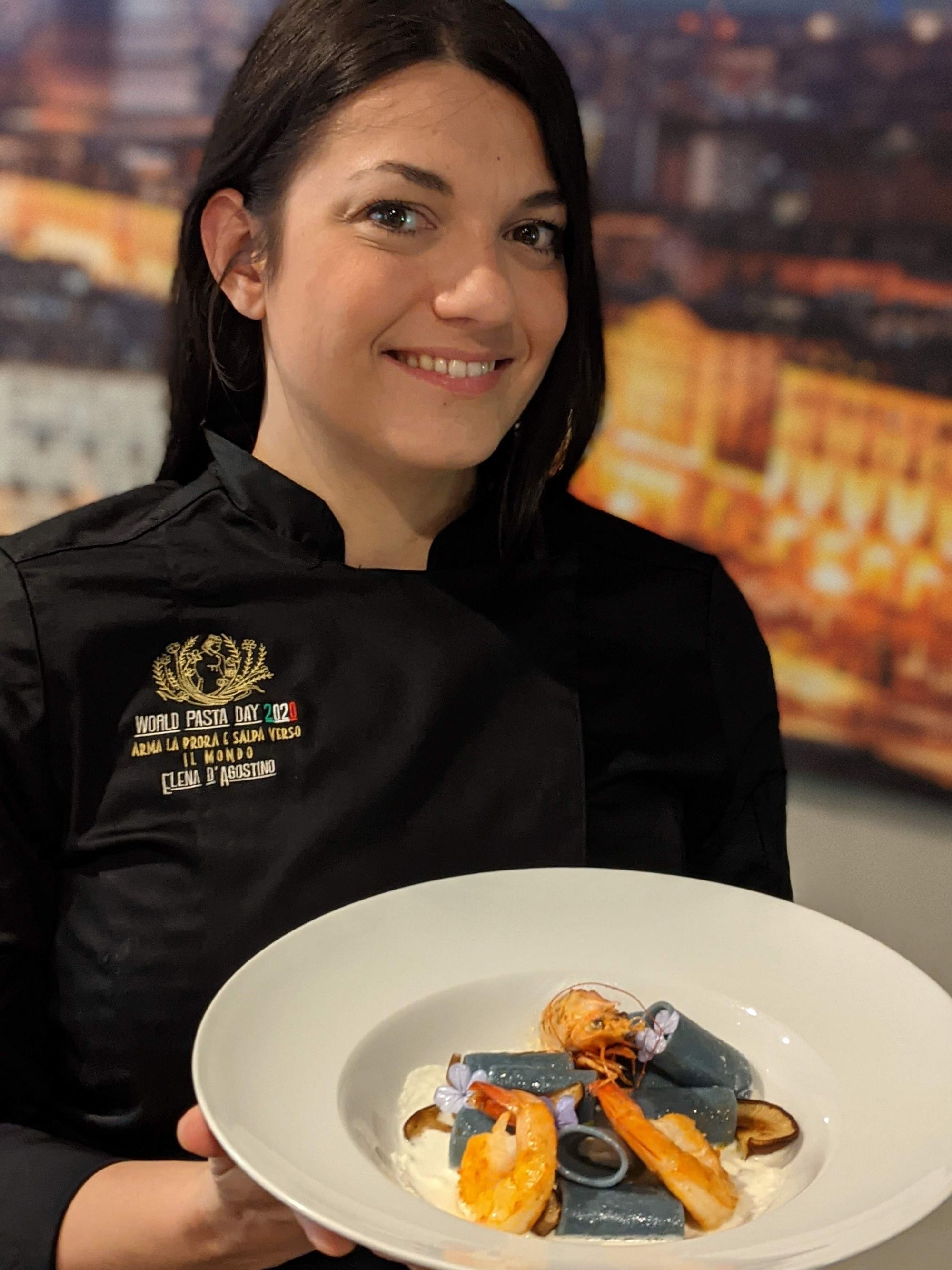 St. Paul Square Dinner Club Elena D'Agostino Burns holding dish