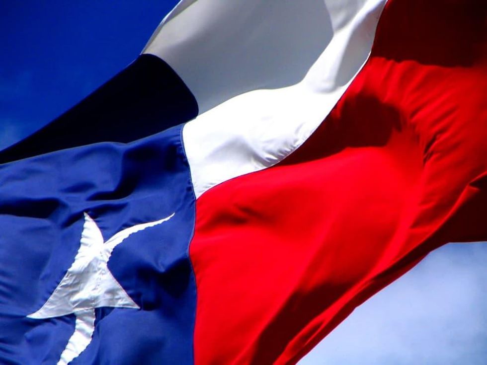 Texas flag flying closeup