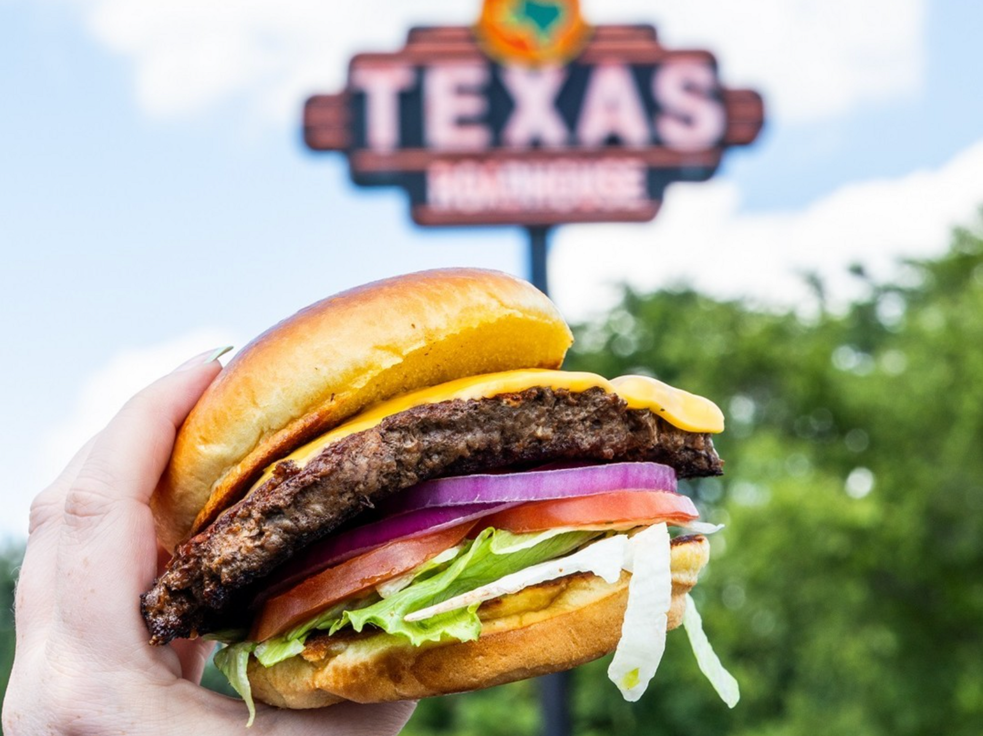 Texas Roadhouse burger and sign
