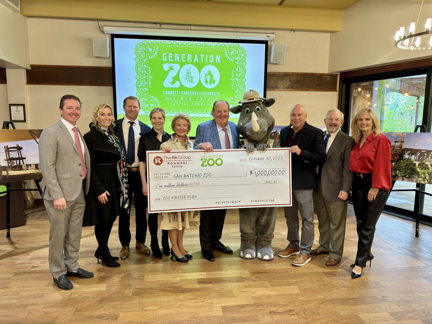 The Greg Kowalski family presenting a ceremonial check to San Antonio Zoo