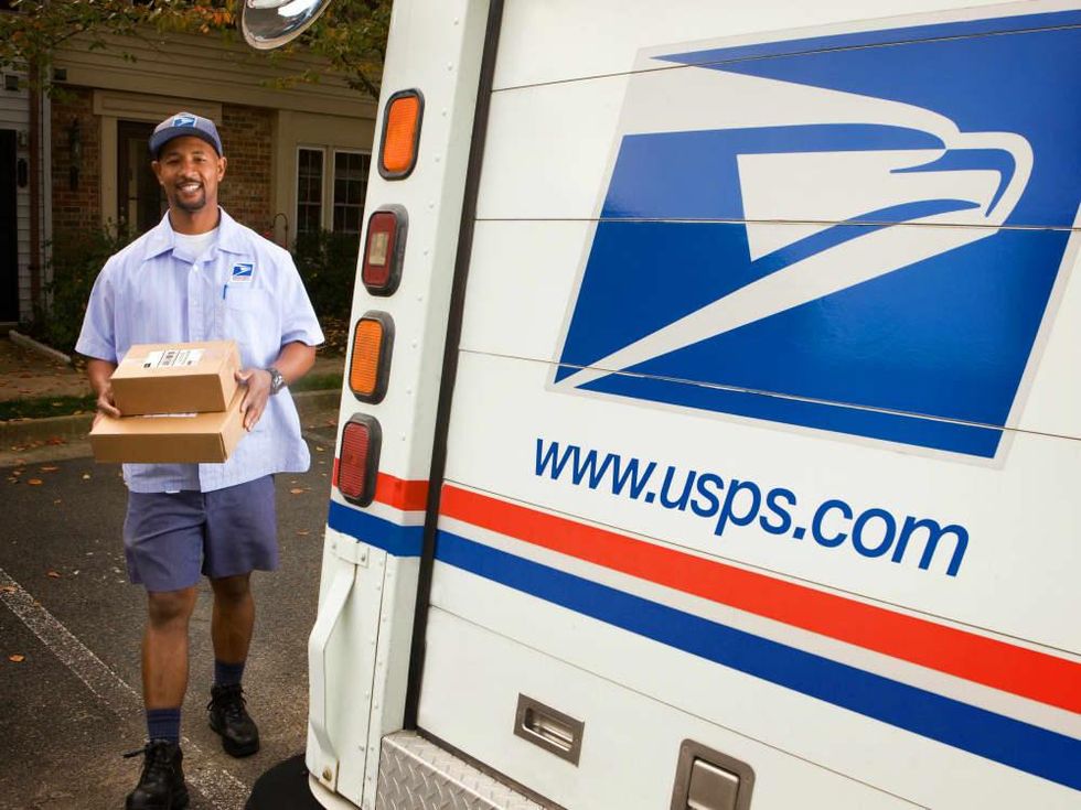 United States postal service mail carrier delivery person mail man