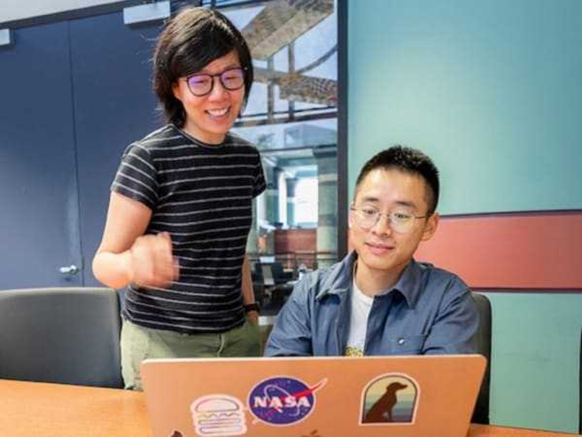 Vicky Yao and Qiliang Lai of Rice University work on a laptop.