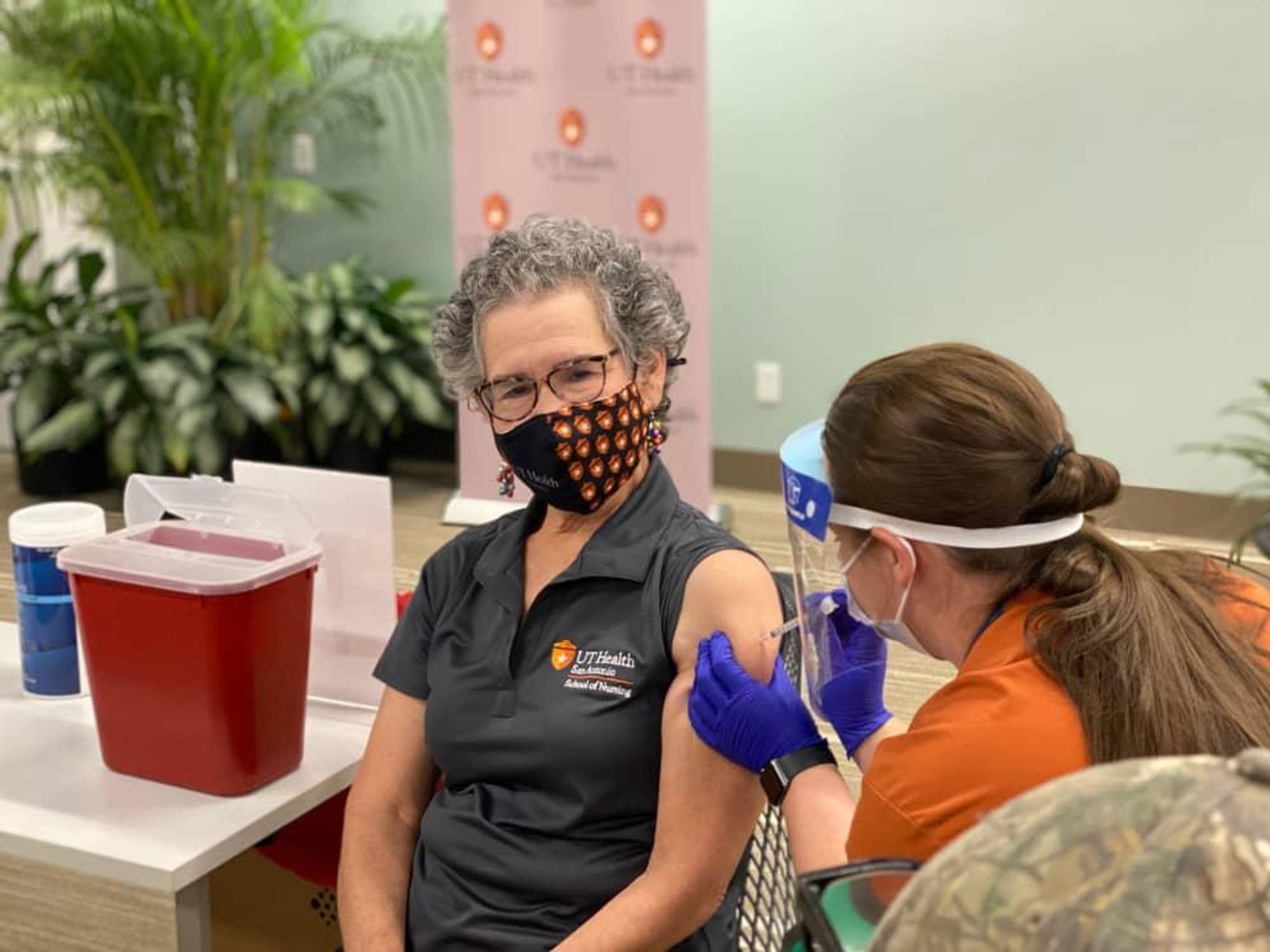 woman getting covid-19 vaccine