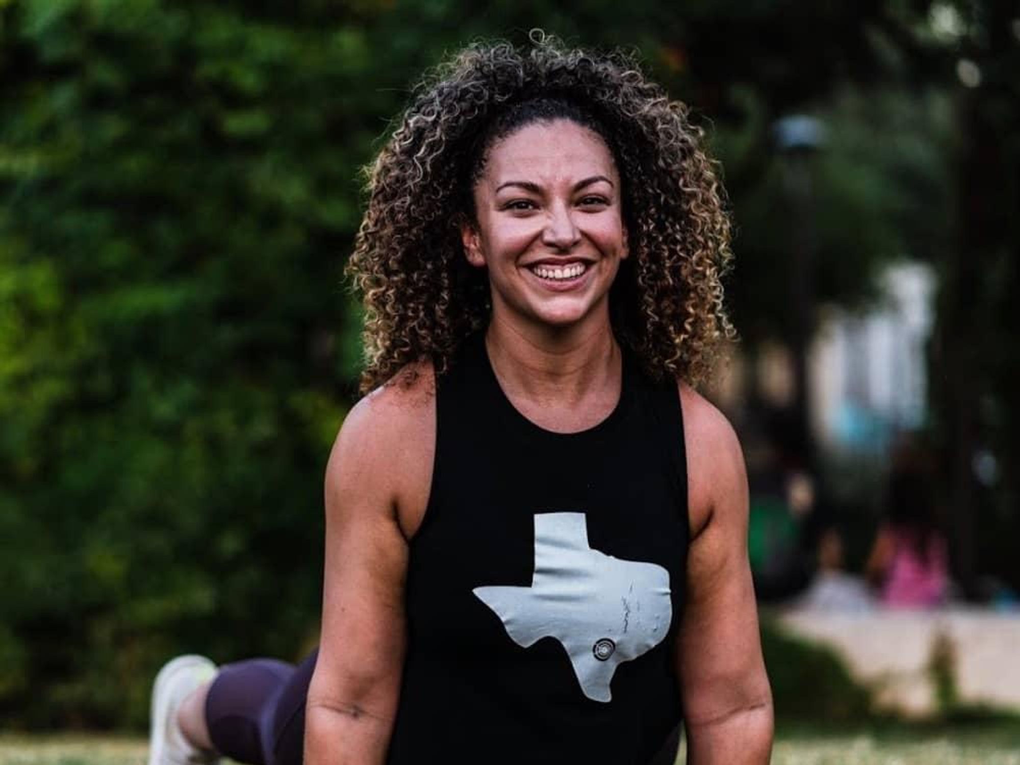 Woman smiling while doing yoga