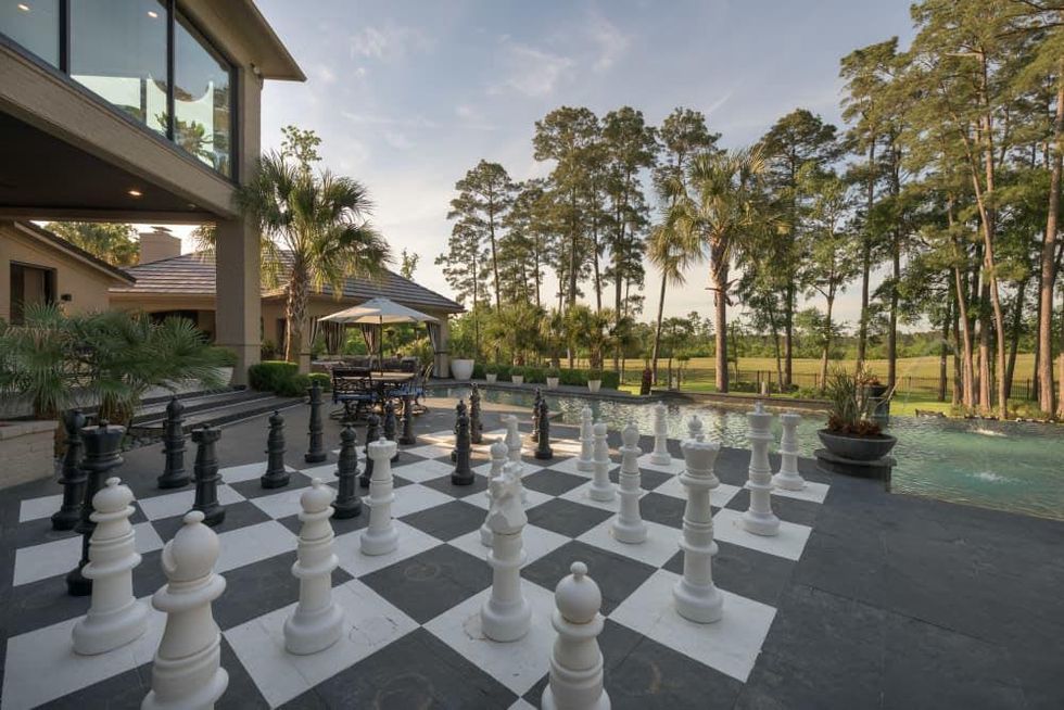 Woodlands three-story closet 47 Grand Circle exterior chess pieces